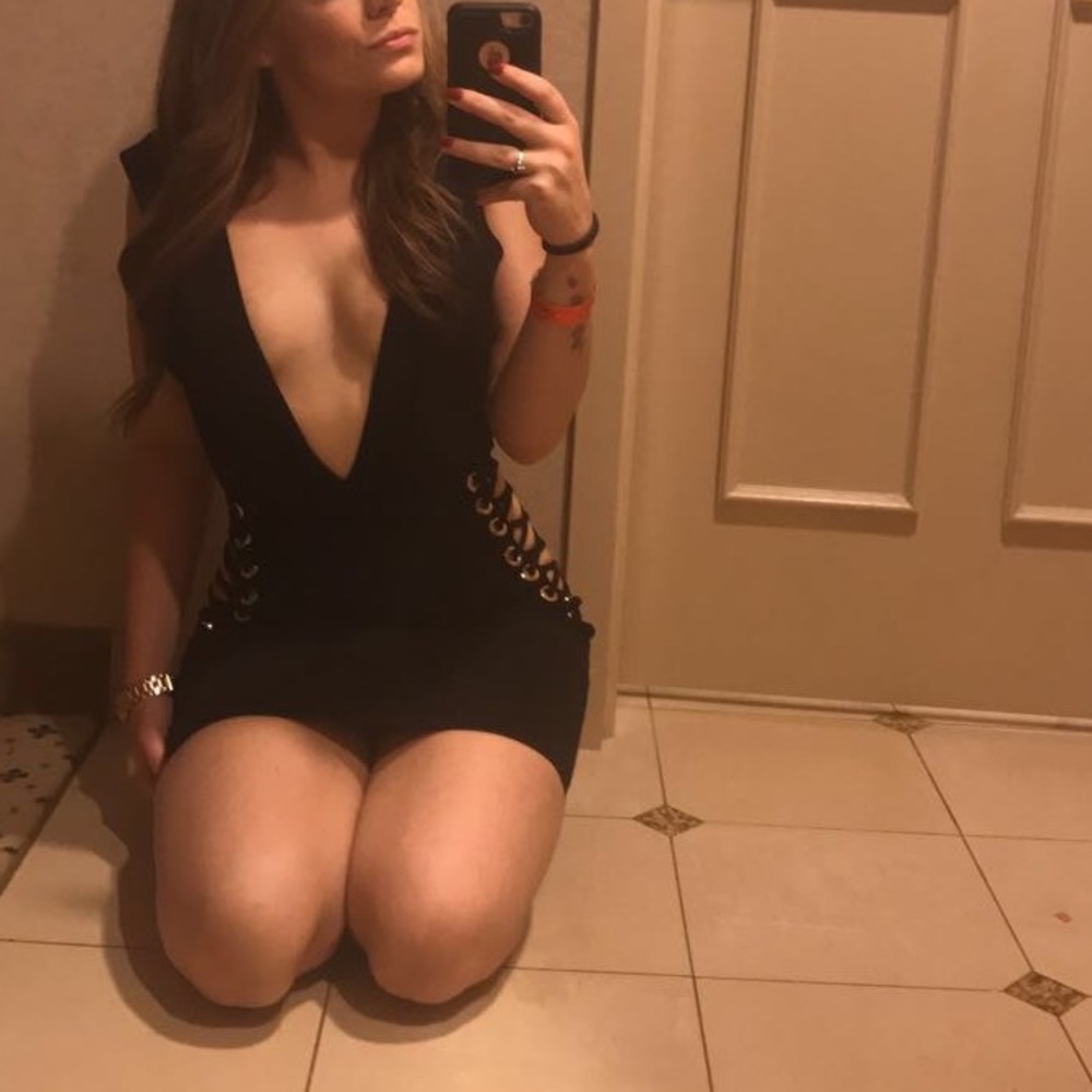 Black low cut dress with criss cross cut outs
